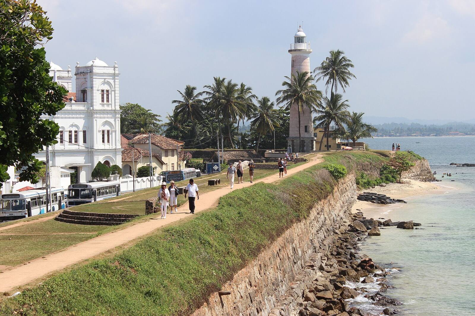 The Galle Fort ramparts with the lighthouse and the Meeran mosque behind