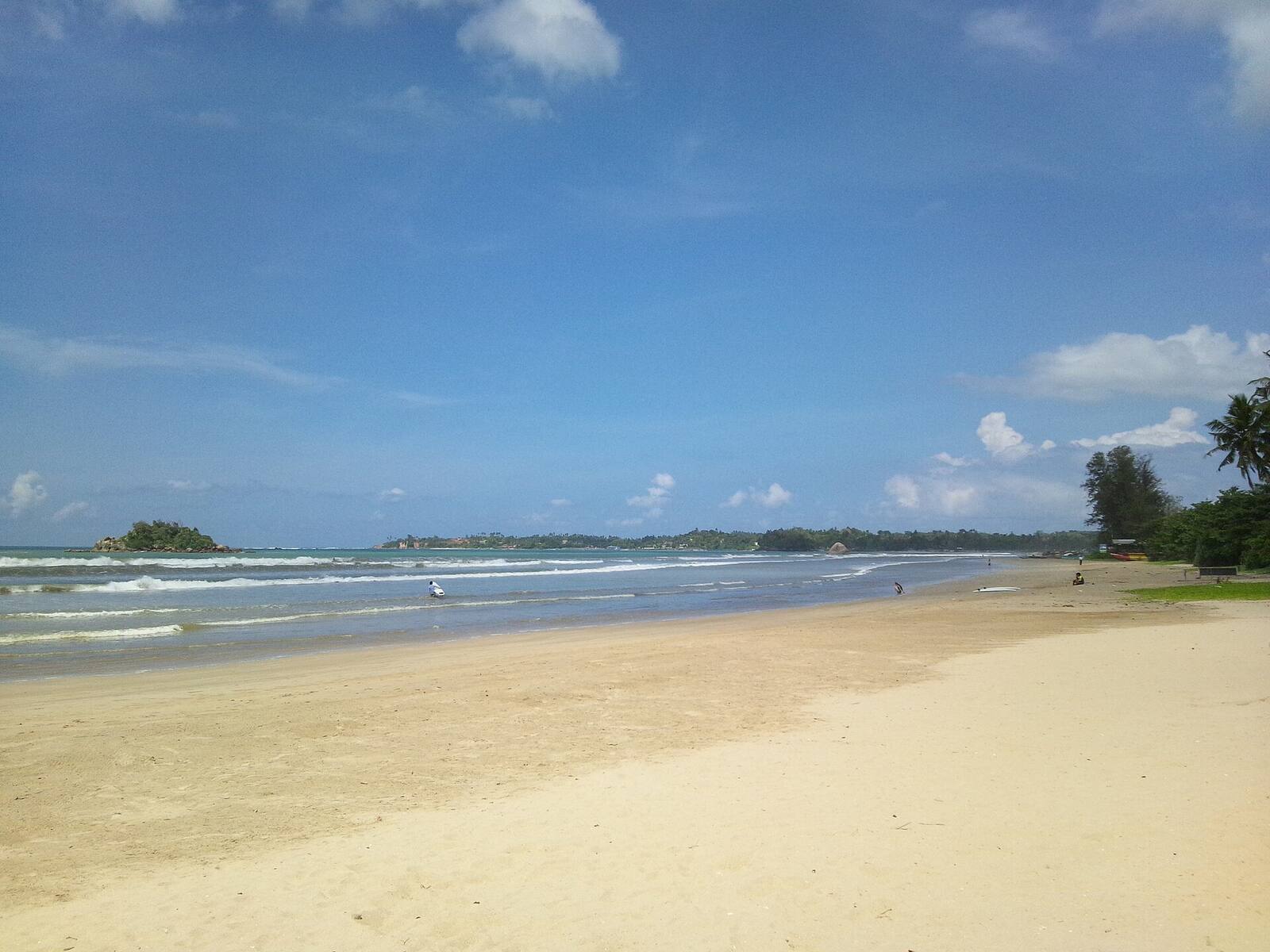 The long sandy curve of Weligama beach