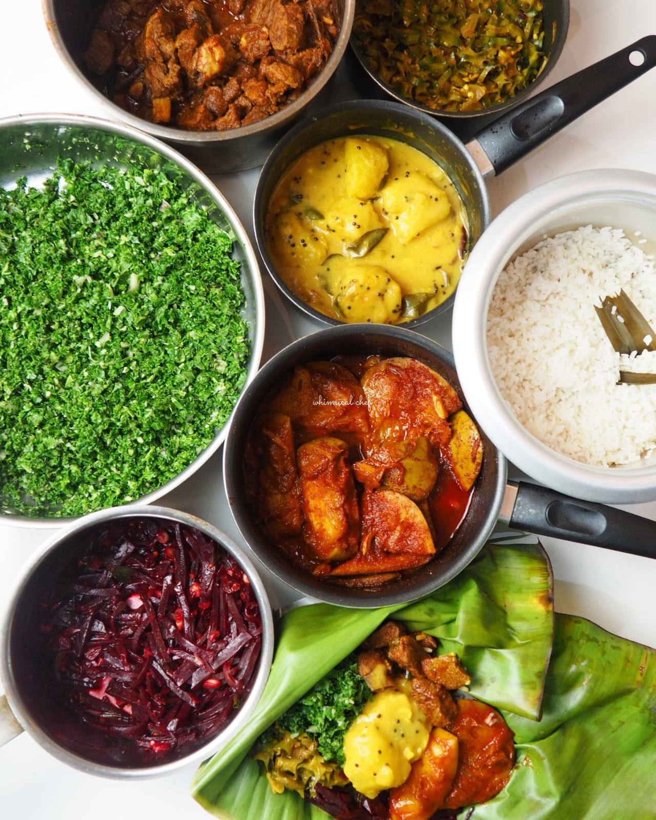 Bowls of Sri Lankan curries, rice and sambol seen from above